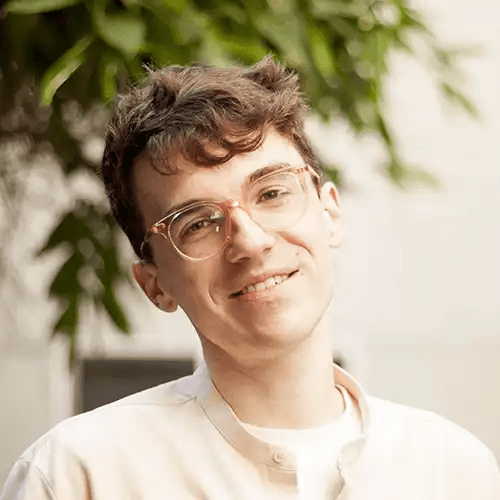 Paul Carter in Glasses Smiling Headshot Image