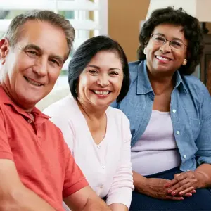 Two Women With a Man Smiling Portrait