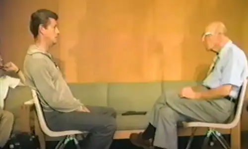 interview with a man in a gray jacket